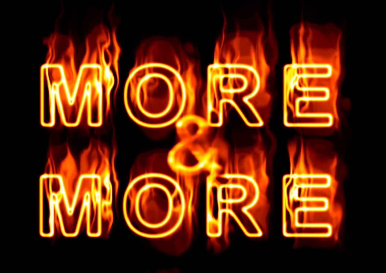 words 'more & more' in flames